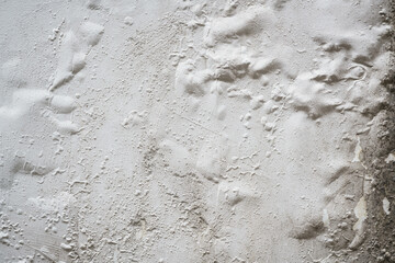 Problem of acrylic white color painting crack abstract surface texture on exterior concrete wall background by humidity.for repair old construction. or vintage renovation home.