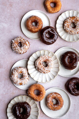 Pretty display of chocolate, sugar and coconut donuts