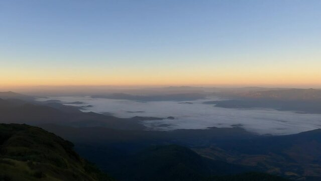Tropical forest nature landscape view with mountain range and moving cloud mist at Kew Mae Pan nature trail, Doi Inthanon, Chiang Mai Thailand