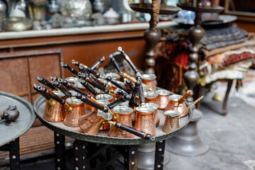 Fototapeta na wymiar Turkish coffee pots, also know as ibrik, cezve, and briki in a street maket