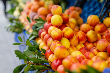 Juicy ripe peach nectarine for sale at farmers market