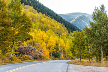 Colorado rocky mountains Castle Creek scenic road trip with autumn fall season with colorful yellow...