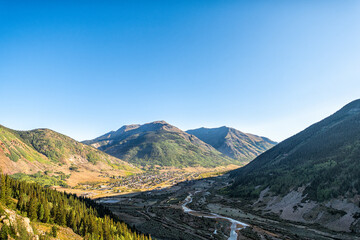 Wide angle aerial high angle view of Silverton, Colorado small mining town from overlook and...