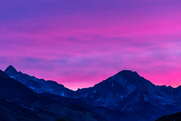 Pink purple sunset in Aspen, Colorado with Rocky mountains of Mt Daly and Cozy Point in autumn with pastel color dramatic twilight sunset dusk