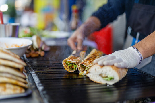 Best Street Food in Istanbul. Preparing the famous Balik Ekmek or Fish Sandwich