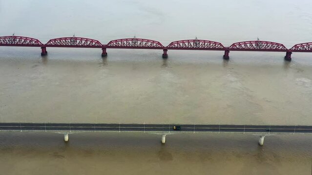 Lalon Shah Bridge, locally known as Pakshey Bridge is a road bridge in Bangladesh over the river Padma. And the Hardinge Bridge is a steel railway truss bridge over the Padma River.