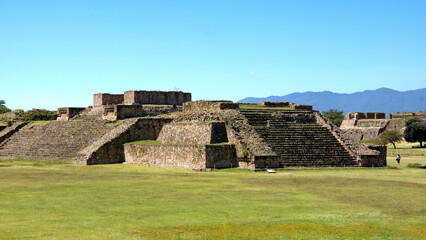 Fototapeta na wymiar Low, stepped pyramid in the ruins of Monte Alban, in Oaxaca, Mexico