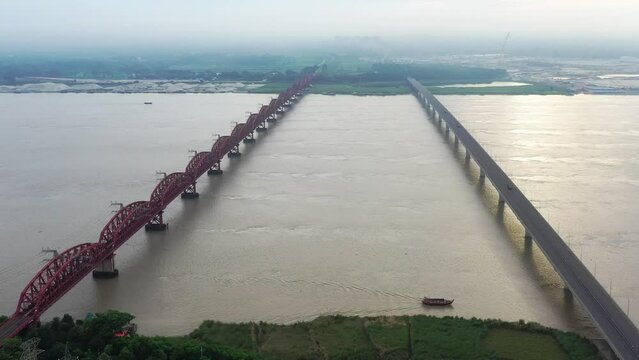 Lalon Shah Bridge, locally known as Pakshey Bridge is a road bridge in Bangladesh over the river Padma. And the Hardinge Bridge is a steel railway truss bridge over the Padma River.