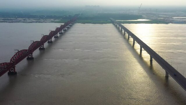 Lalon Shah Bridge, locally known as Pakshey Bridge is a road bridge in Bangladesh over the river Padma. And the Hardinge Bridge is a steel railway truss bridge over the Padma River.