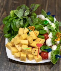 Plate with cheese and herbs