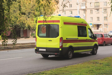 Fototapeta na wymiar Ambulance car moves along the street