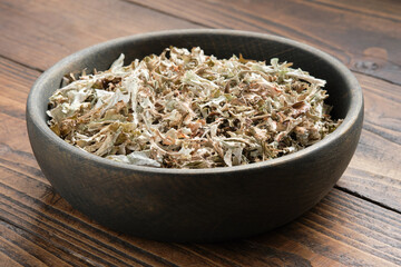 Bowl of dried Iceland moss for making healthy herbal cough tea.  Icelandic moss, natural cough...