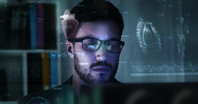 Young Caucasian Male Using Computer With Holographic Animated Medical MRI, 3D Models and Patient Data. Doctor Checking Patient Information at Night in Office. VR, AR. Graphic User Interface.