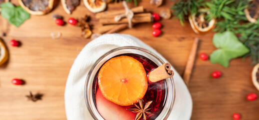 Gluhwein sweet hot warm Mulled red Wine or punch tea in mug cup glass spices citrus aromatic...