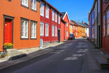 Fototapeta na wymiar Street with colofful houses in Roeros, Norway
