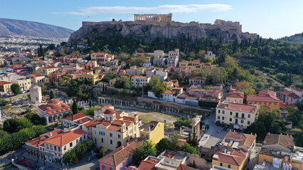 Fototapeta na wymiar Aerial drone photo of iconic Acropolis hill and the Parthenon as seen from picturesque Plaka district - ancient Roman forum, Athens historic centre, Attica, Greece