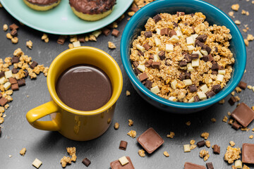 Chocolate granola cereals with chocolate milk and doughnuts