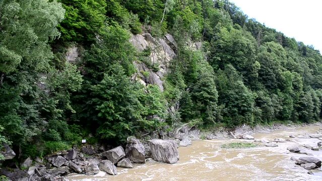 Mountain and mountain river. Fast stream of the river