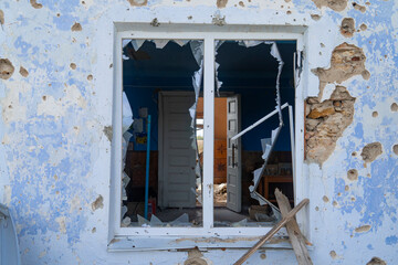 War in Ukraine. 2022 Russian invasion of Ukraine. Window of a house damaged by shelling (close-up)....