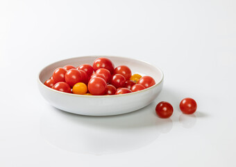 Small tomatoes in a white bowl