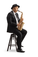 Mature male sax player playing and sitting on a chair