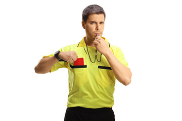 Football referee blowing a whistle and taking a red card out of pocket