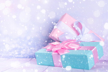 Christmas background with blue and pink gifts