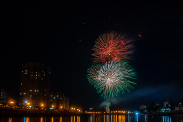 fireworks over the river in the city
