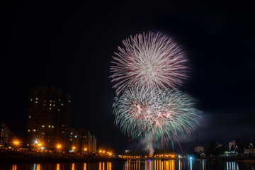 fireworks over the river in the city