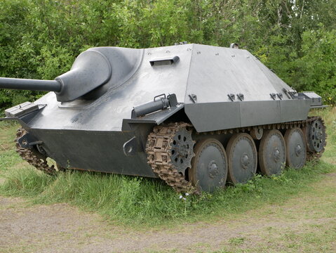 German light self-propelled artillery installation of the Second World War. An armored vehicle with a camouflage dark gray color on a forest road.