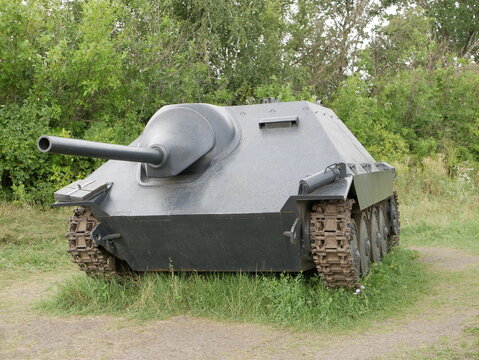 German light self-propelled artillery installation of the Second World War. An armored vehicle with a camouflage dark gray color on a forest road.