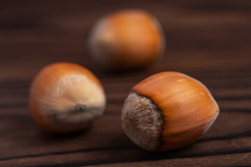 Organic fresh hazelnut on wooden background close up