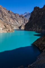 Turquoise water of Attabad lake around mountains in Northern Pakistan, formed through a Land Slide in 2010. Hunza Nagar, Gilgit-Baltistan, Pakistan