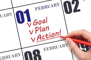 Hand writing text GOAL PLAN ACTION on calendar date February 1. Motivation for a new day. Business...