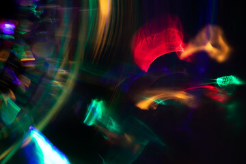Blurred Light painting one exposure in camera. light glares with a spectral gradient on a dark...