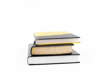 A stack of books on the table. On a white background.