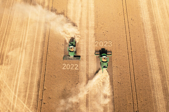 Dobrich, Bulgaria - July 03, 2022: Modern John Deere combine harvesting grain in the field. 2023 Happy new year concept!