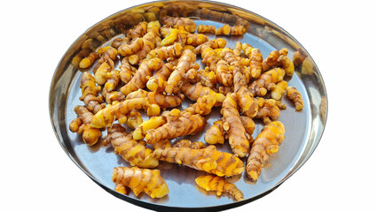 Fresh Turmeric Roots on metal plate