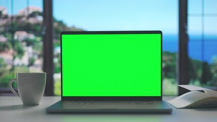 Comfortable working place near seaside window, laptop with chroma screen for copy space, coffee cup and notepad - Powered by Adobe