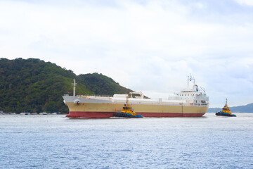 Tanker being towed at the entrance to the port of Santos
