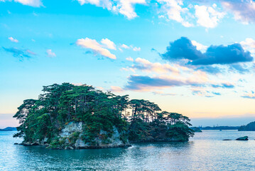 Matsushima Bay in dusk, beautiful islands covered with pine trees and rocks. One of the Three Views...