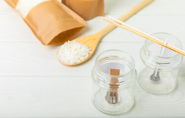 Set for homemade natural white eco-friendly soy wax candles in glass. Idea for hobby, business. Making fashionable candles with your own hands without harm to health.DIY candle. hobby concept