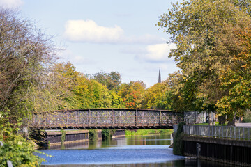 Fototapeta na wymiar Disused metal railway bridge over the river welland In Spalding, Lincolnshire, East Midlands, England
