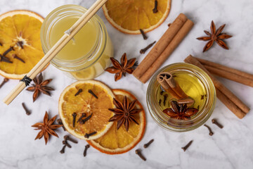 The process of making homemade candles on the table. Close-up. Pouring molten wax. Soy candles handmade with wooden wicks. Vegan product without cruelty to animals.Decor.