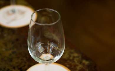 Close-up of empty wine glasses on table.