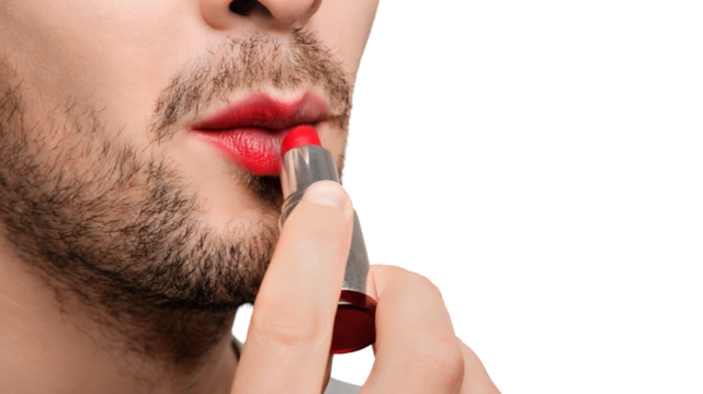 Close up cropped shot of a man applying red lipstick, painting his lips.