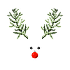 Creative layout made of Christmas tree branches with red bauble and a cute Christmas deer. The mood of happy new year.