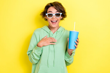 Photo portrait of pretty young girl point self excited sunglass plastic cup dressed stylish green...