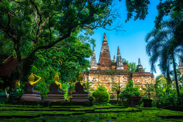 Naklejka premium Wat Chet Yot or Wat Photharam Maha Wihan, seven pagoda temple It is a major tourist attraction in Chiang Mai, Thailand.with evening,Temple in Chiang Mai.
