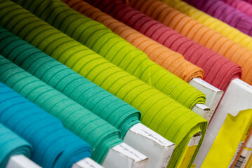 bolts of colored fabric